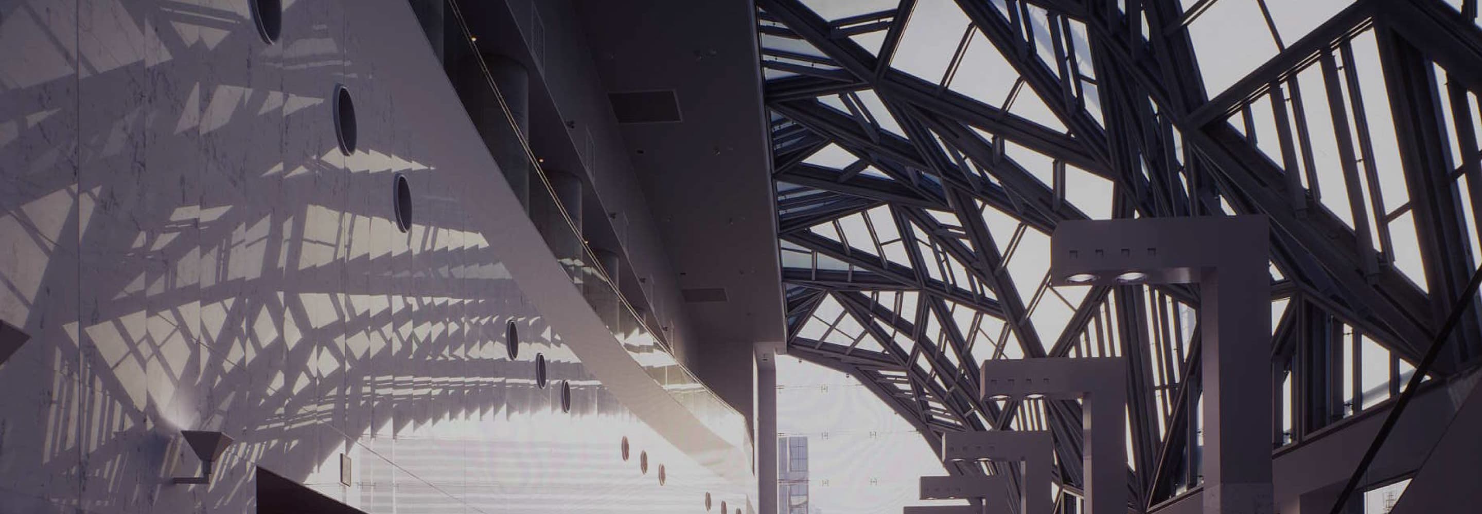 自然光が差し込む幾何学模様のガラス天井と現代建築のアトリウム